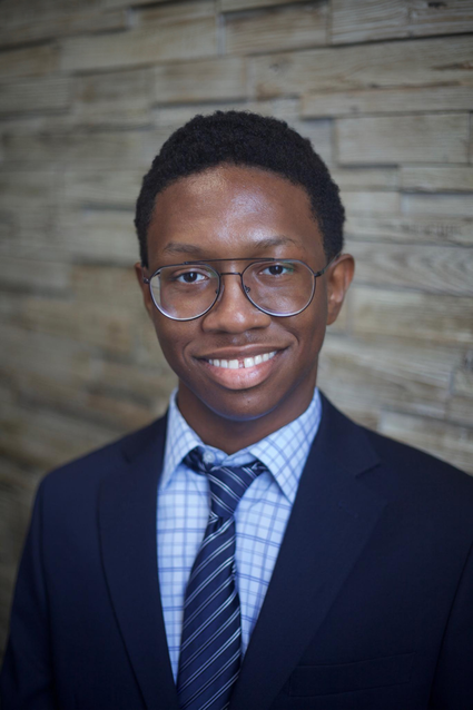 A professional headshot of Tremar Thomas